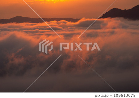 Beautiful dramatic sunset in the mountains. Landscape lot of fog Phu Thok Mountain at Chiang Khan ,Loei Province in Thailand. Beautiful dramatic sunset in the mountains. Landscape lot of fog Phu Thok Mountain at Chiang Khan ,Loei Province in Thailand. 109613078