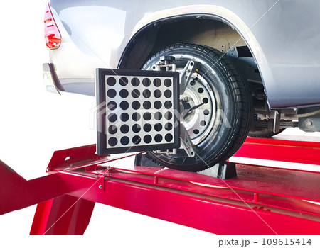 Wheel alignment of car on lifting stand with a laser sensor during suspension angle adjustment 109615414