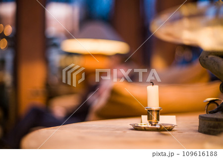Warmth in Repose: A Candlelit Evening Indoors Warmth in Repose: A Candlelit Evening Indoors 109616188