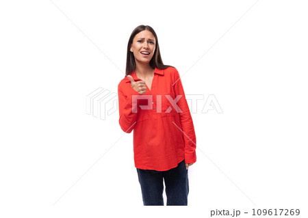 young pretty brunette office worker woman dressed in a red loose shirt on a white background young pretty brunette office worker woman dressed in a red loose shirt on a white background 109617269