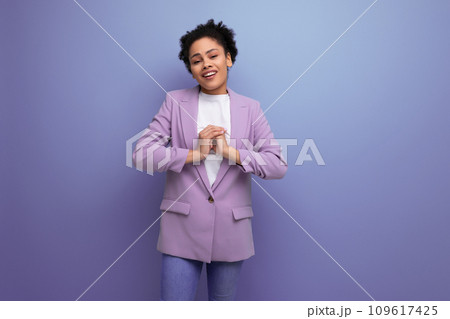 young pretty latin secretary woman with wavy hair dressed in purple jacket on studio background with young pretty latin secretary woman with wavy hair dressed in purple jacket on studio background with 109617425