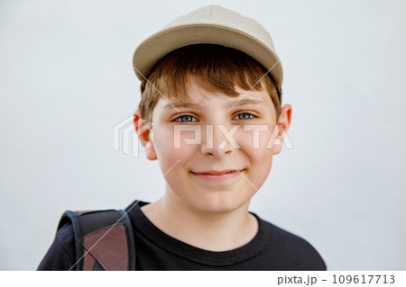 Portrait of preteen school kid boy. Beautiful happy child looking at the camera. Schoolboy smiling. Education concept. 109617713