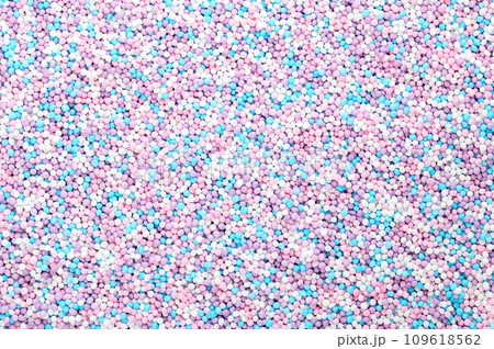 Colorful sprinkles made of tiny sugar balls. Mix of purple, blue, rose and white nonpareils. Decorative and edible Hundreds and Thousands made of sugar and starch, used as decoration and as topping. Colorful sprinkles made of tiny sugar balls. Mix of purple, blue, rose and white nonpareils. Decorative and edible Hundreds and Thousands made of sugar and starch, used as decoration and as topping. 109618562