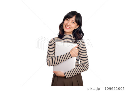 Beautiful young Asian woman on sweater clothing holding laptop pc computer and looking at camera with smile face, isolated on white background 109621005
