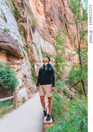Zion National Park with different trail on the way. Young man walking in park 109623372