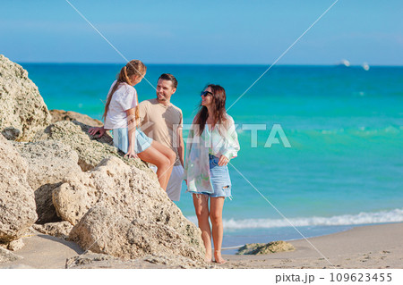 Happy family on the beach during summer vacation 109623455