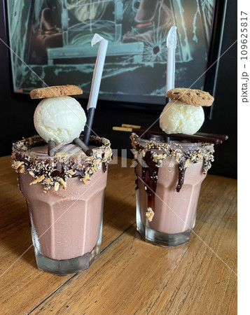 Milkshake Chocolate with cookies and vanilla ice cream toppings 109625817