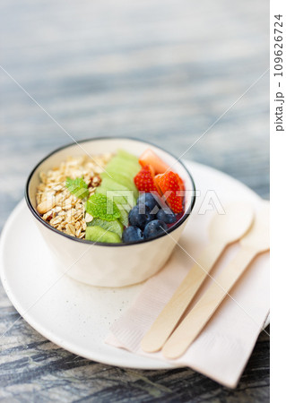 Healthy food rich vitamin and fiber morning meal bowl. colorful mix berry fruity with cereal whole grain food vertical shot. 109626724