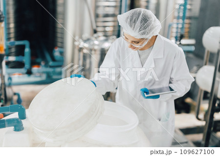 hygiene staff worker in foods and drinks clean factory. working women in water plant industry quality control check. hygiene staff worker in foods and drinks clean factory. working women in water plant industry quality control check. 109627100