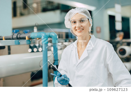 portrait happy women staff worker in drinking water plant work control water quality purification test process. portrait happy women staff worker in drinking water plant work control water quality purification test process. 109627123