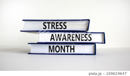 Stress awareness month symbol. Books with words 'Stress awareness month'. Beautiful white background. Psychological, business and stress awareness month concept. Copy space. 109629647