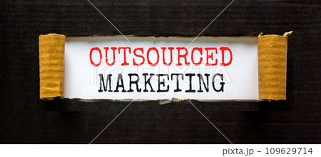 Outsourced marketing symbol. Concept words Outsourced marketing on beautiful white paper. Beautiful black paper background. Business Outsourced marketing concept. Copy space. 109629714