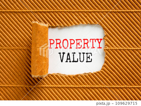 Property value symbol. Concept words Property value on beautiful white paper. Beautiful brown paper background. Business property value concept. Copy space. 109629715
