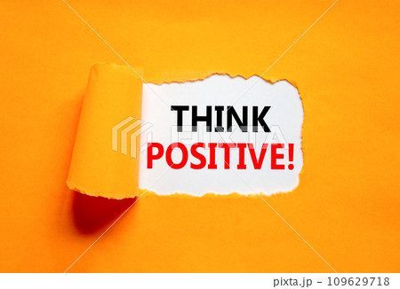 Think positive symbol. Concept words Think positive on beautiful white paper. Beautiful orange table orange background. Business, motivational think positive thinking concept. Copy space. 109629718