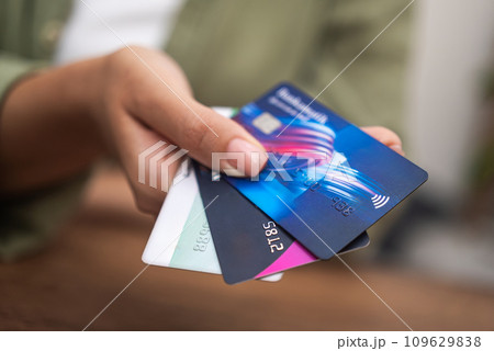 close up woman hand holding heap of credit cards, online payment shopping banking, contactless Credit cards close up woman hand holding heap of credit cards, online payment shopping banking, contactless Credit cards 109629838
