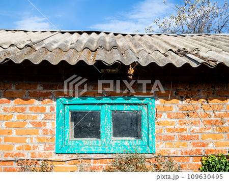 wall of rustic brick barn with dirty small window 109630495