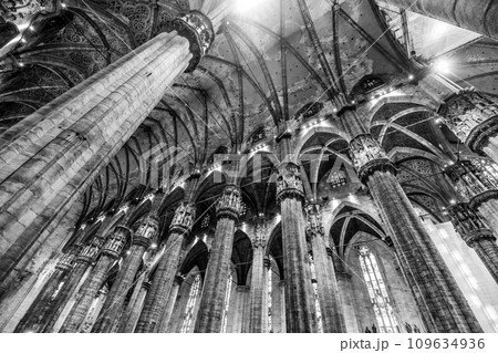 Interior of Metropolitan Cathedral-Basilica of the Nativity of Saint Mary, aka Duomo, Milan, Italy. Black and white photography. Interior of Metropolitan Cathedral-Basilica of the Nativity of Saint Mary, aka Duomo, Milan, Italy. Black and white photography. 109634936