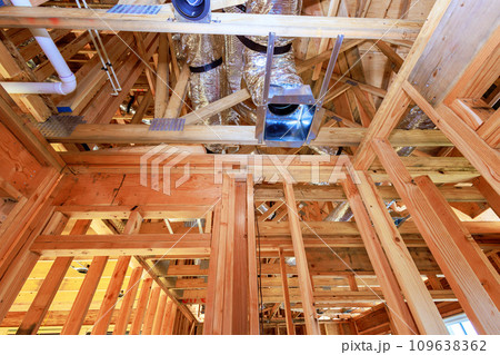 Installing HVAC conditioning, ventilation system of air metal duct pipeline for new home Installing HVAC conditioning, ventilation system of air metal duct pipeline for new home 109638362