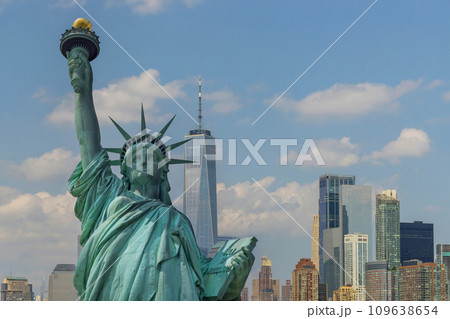 AStatue of Liberty with beautifully Manhattan at New York City background 109638654