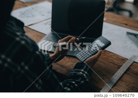 Two business man construction site engineer. Engineering objects on workplace with partners interacting on background Two business man construction site engineer. Engineering objects on workplace with partners interacting on background 109640270