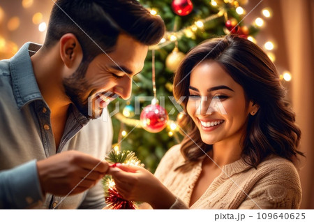 cheerful smiling adorable hispanic woman decorating Christmas tree with happy Husband, putting toys on branches, enjoying preparing for New Year celebration at home, miracle time concept. AI cheerful smiling adorable hispanic woman decorating Christmas tree with happy Husband, putting toys on branches, enjoying preparing for New Year celebration at home, miracle time concept. AI 109640625