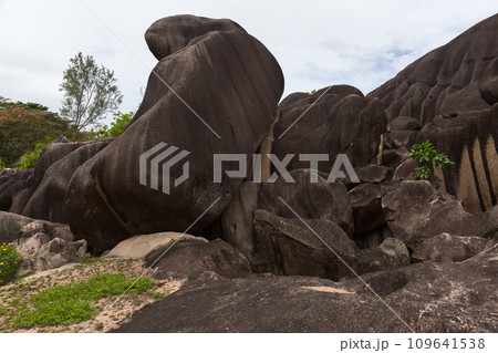 Landscape photo with the black monolith of the Giant Union Rock, Seychelles 109641538