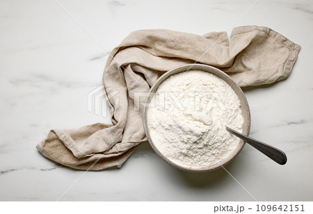 bowl of flour and linen towel 109642151