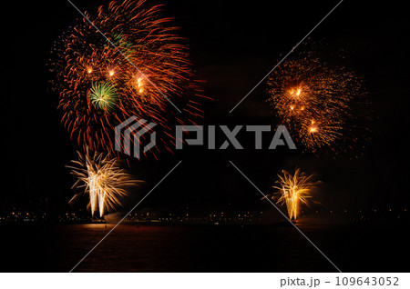 Fireworks explosions with shining sparks on dark background. 109643052