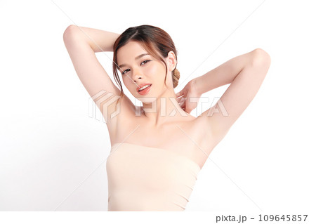 Beautiful Young Asian woman lifting hands up to show off clean and hygienic armpits or underarms on white background, Smooth armpit cleanliness and protection concept 109645857