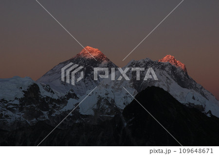 Last sunlight of the day touching Mount Everest and Lhotse, Nepal. 109648671