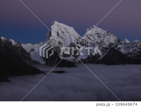 Purple sky over Mount Cholatse and Tobuche, Nepal. Purple sky over Mount Cholatse and Tobuche, Nepal. 109648674