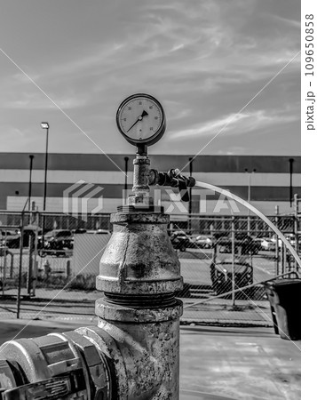 soil vapor extraction test well header with pressure gauge and sample line. 109650858