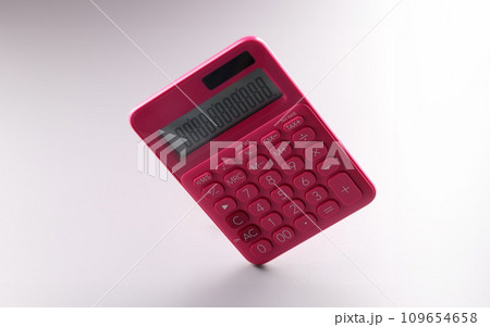 Red calculator with numbers on screen, work on battery 109654658