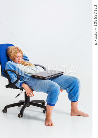 girl in pajamas with a laptop girl in pajamas with a laptop 109657123