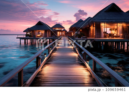 Bungalows for summer vacation vacations on the ocean on sunset. Tropical holidays 109659461