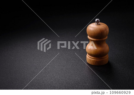 Beautiful wooden figured pepper shaker or salt shaker with a mill Beautiful wooden figured pepper shaker or salt shaker with a mill 109660929