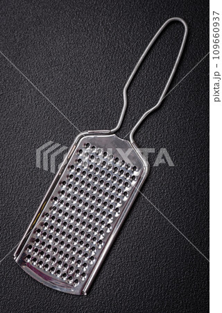 Beautiful small metal kitchen grater with handle 109660937