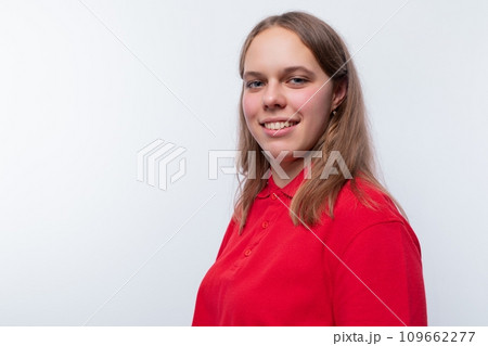 Cute teenage girl with blond hair in a red T-shirt 109662277