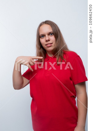 Caucasian girl with brown hair is wearing a red T-shirt 109662450
