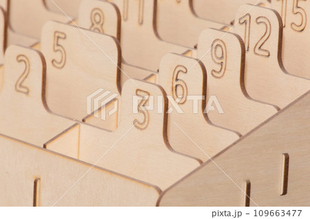 Numbered Sections Figures for Storage of Objects and Parts Made of OSB Material Signs and Symbols Close-up Detail Macro 109663477