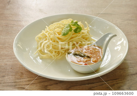 boiled spaghetti dressing spicy fried chop chicken with chili and basil sauce on plate   109663600