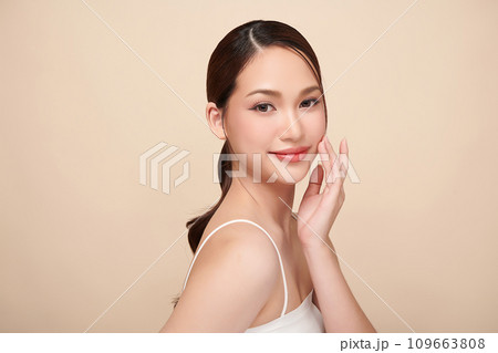 Beautiful young asian woman with clean fresh skin on beige background, Face care, Facial treatment, Cosmetology, beauty and spa, Asian women portrait. Beautiful young asian woman with clean fresh skin on beige background, Face care, Facial treatment, Cosmetology, beauty and spa, Asian women portrait. 109663808