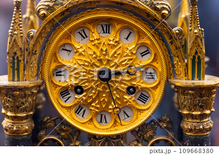 Vintage chiming grandfather clock dial with golden decoration in Gothic style 109668380