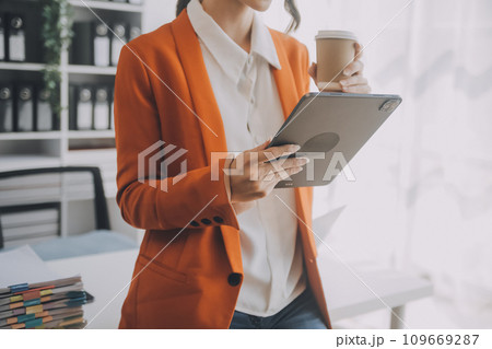 Audit concept,Administrator business man financial inspector and secretary making report calculating balance. Internal Revenue Service checking document. 109669287