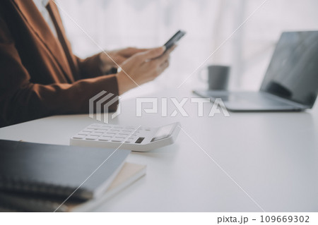 Audit concept,Administrator business man financial inspector and secretary making report calculating balance. Internal Revenue Service checking document. Audit concept,Administrator business man financial inspector and secretary making report calculating balance. Internal Revenue Service checking document. 109669302