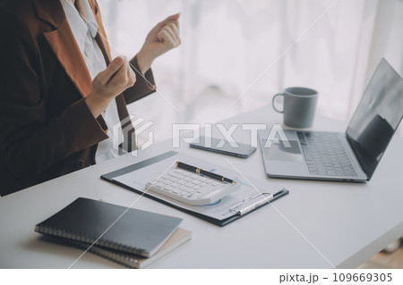 Audit concept,Administrator business man financial inspector and secretary making report calculating balance. Internal Revenue Service checking document. 109669305