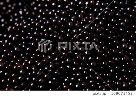 Closeup of natural black caviar as background, texture of expensive luxury fresh sturgeon caviar macro photo. 109671455