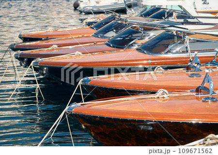 Few luxury retro motor boats in row at the famous motorboat exhibition in the principality of Monaco, Monte Carlo, the most expensive boats for the richest people, boats for rich clients Few luxury retro motor boats in row at the famous motorboat exhibition in the principality of Monaco, Monte Carlo, the most expensive boats for the richest people, boats for rich clients 109671562