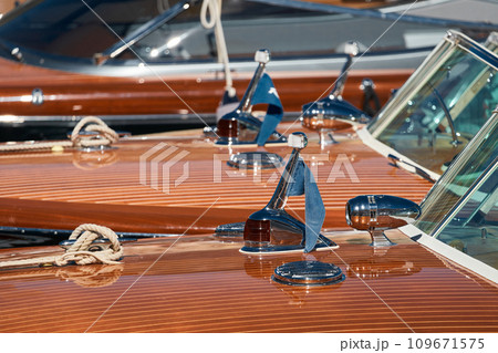 Few luxury retro motor boats in row at the famous motorboat exhibition in the principality of Monaco, Monte Carlo, the most expensive boats for the richest people, boats for rich clients Few luxury retro motor boats in row at the famous motorboat exhibition in the principality of Monaco, Monte Carlo, the most expensive boats for the richest people, boats for rich clients 109671575