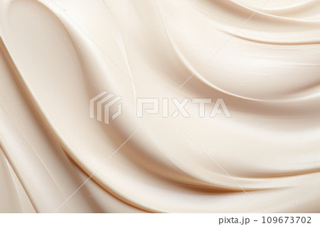 Yellow creamy lotion conditioner backdrop. Beauty wavy skincare cosmetic product closeup, smudged moisturizer. Cream cosmetic texture swirl, smooth creme moisture background. 109673702